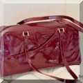 H10. Dior red patent leather handbag. 